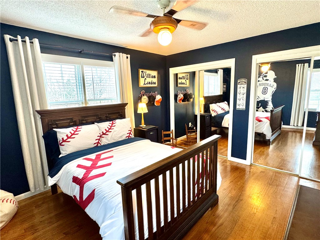 104 Lark Lane Anderson, SC 29625 - Photo 33 of 49 This spacious bedroom 2 features hardwood flooring and double the closets and a ceiling fan/light.