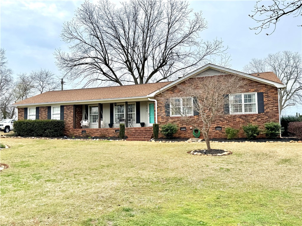 104 Lark Lane Anderson, SC 29625 - Photo 39 of 49 This charming residence features a classic brick exterior and an inviting front yard with manicured landscaping.