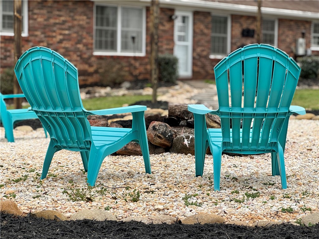 104 Lark Lane Anderson, SC 29625 - Photo 43 of 49 This inviting outdoor space offers a charming retreat with a rock garden and a cozy fire pit.