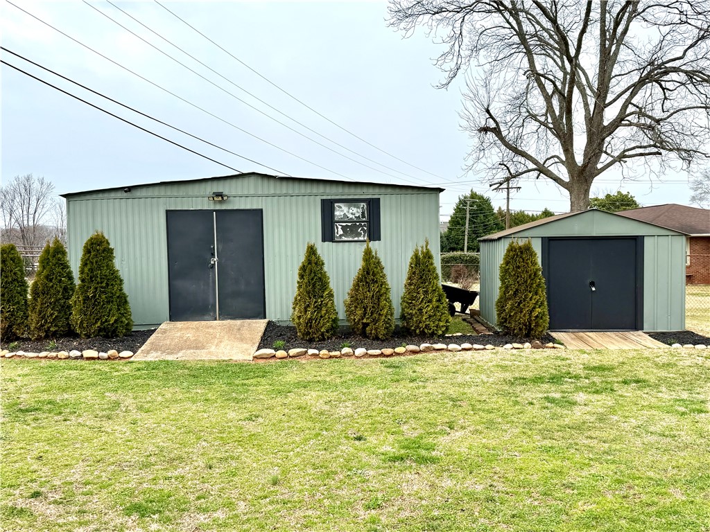 104 Lark Lane Anderson, SC 29625 - Photo 44 of 49 These two sheds provide ample storage, each featuring secure doors and sturdy construction for diverse needs.