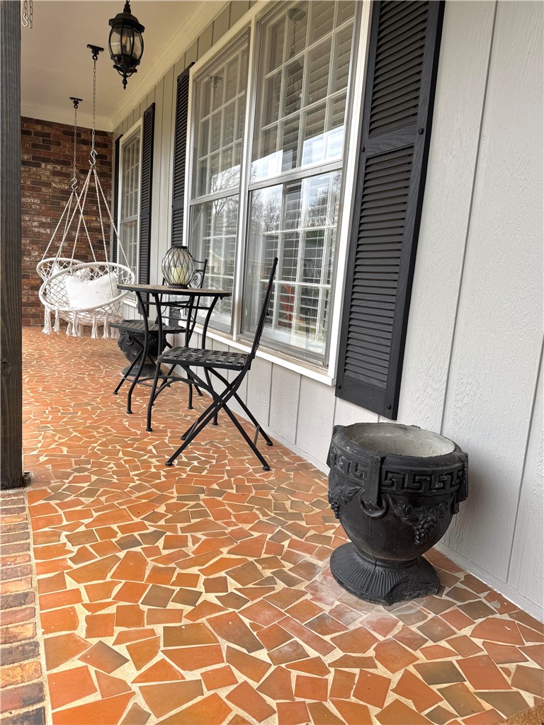 104 Lark Lane Anderson, SC 29625 - Photo 5 of 49 This inviting porch features a unique mosaic tile floor, perfect for serene outdoor relaxation.