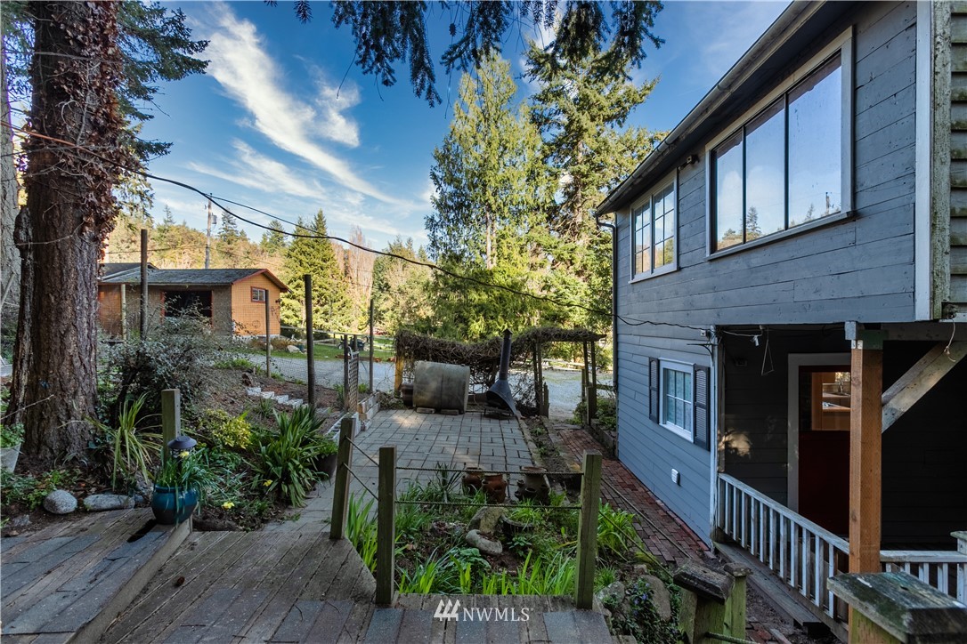13909 Southwest Pohl Road Vashon, WA 98070 - Photo 2 of 24 a view of a house with brick walls
