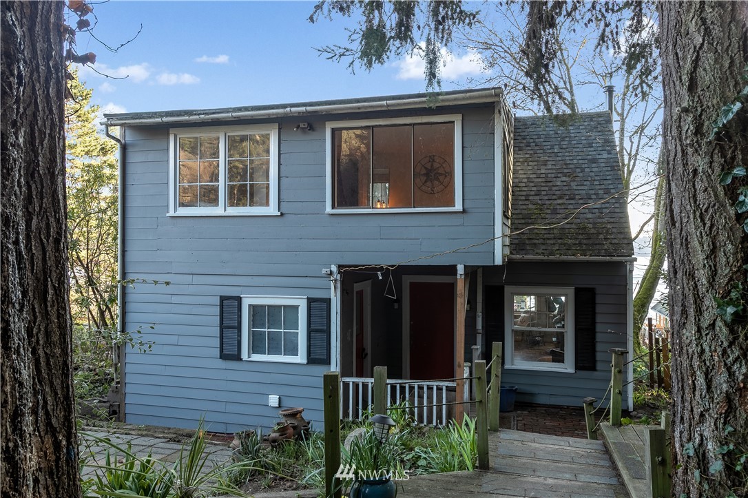 13909 Southwest Pohl Road Vashon, WA 98070 - Photo 19 of 24 a front view of a house with a yard