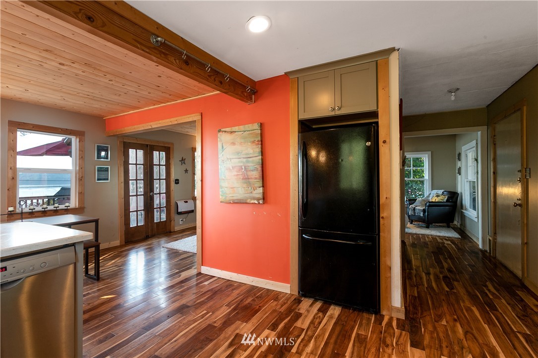13909 Southwest Pohl Road Vashon, WA 98070 - Photo 5 of 24 a view of a hallway view with wooden floor and staircase