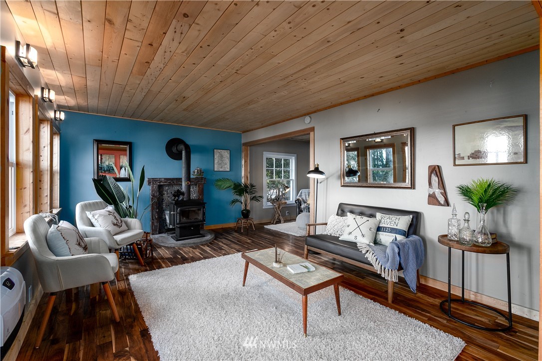 13909 Southwest Pohl Road Vashon, WA 98070 - Photo 6 of 24 a living room with furniture a couch and a potted plant