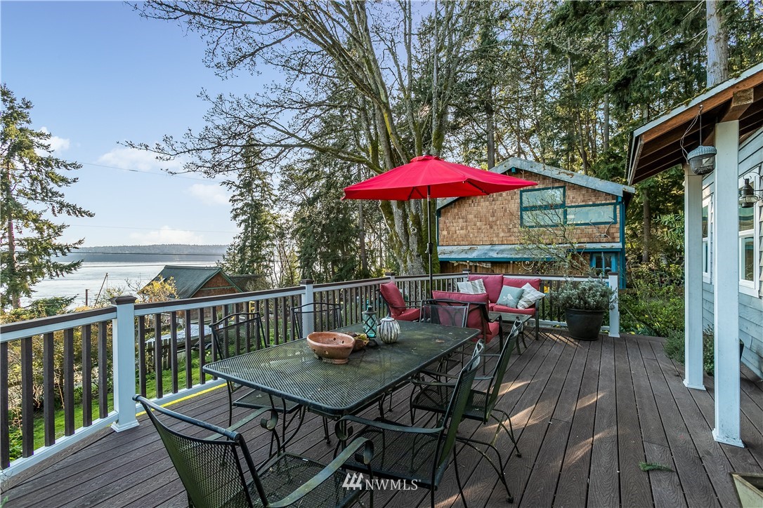 13909 Southwest Pohl Road Vashon, WA 98070 - Photo 10 of 24 a view of balcony with outdoor seating and wooden floor