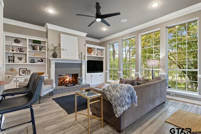 a living room with furniture and a flat screen tv