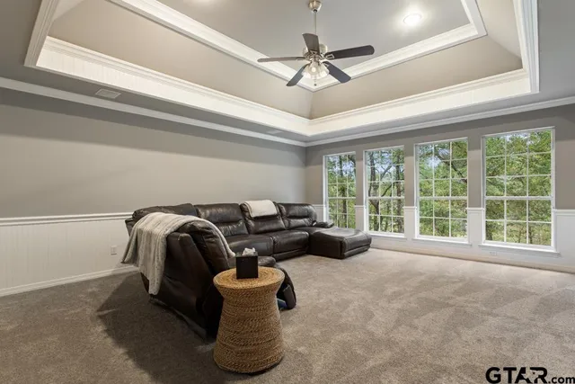 a view of balcony with chairs and couches with wooden floor