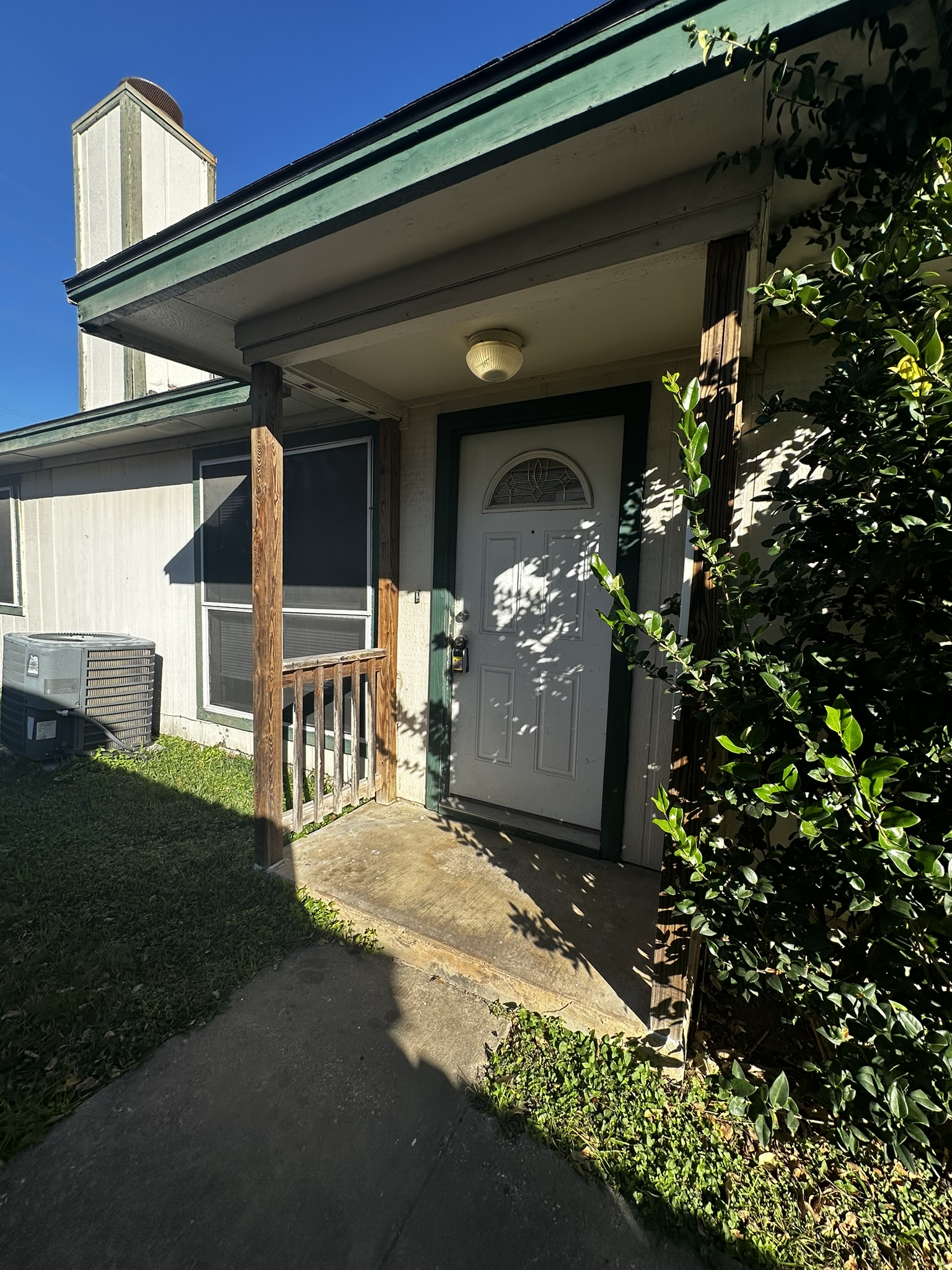 Doorway to property with a chimney