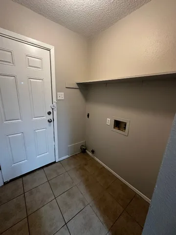 a kitchen with stainless steel appliances a stove a sink and a refrigerator