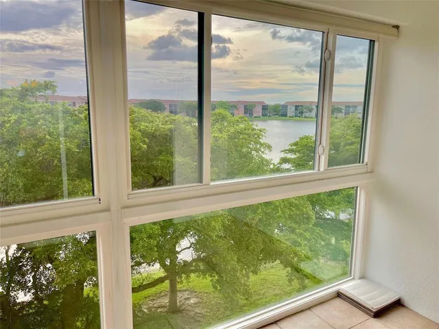 a view of a room with a large window