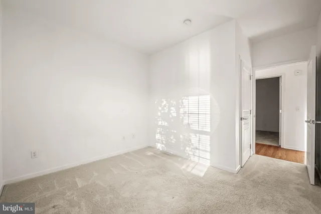 a kitchen with a stove sink and cabinets