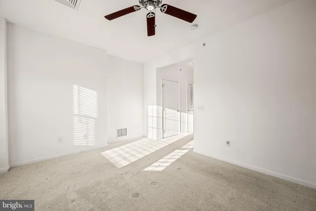 a view of a kitchen sink and chandelier