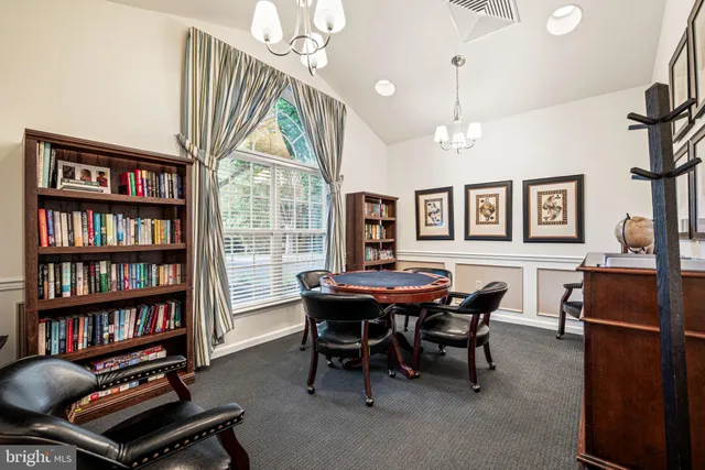 a hallway with a dining table chairs and entryway