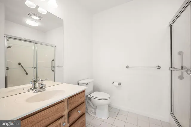 a spacious bedroom with a large bed and a window