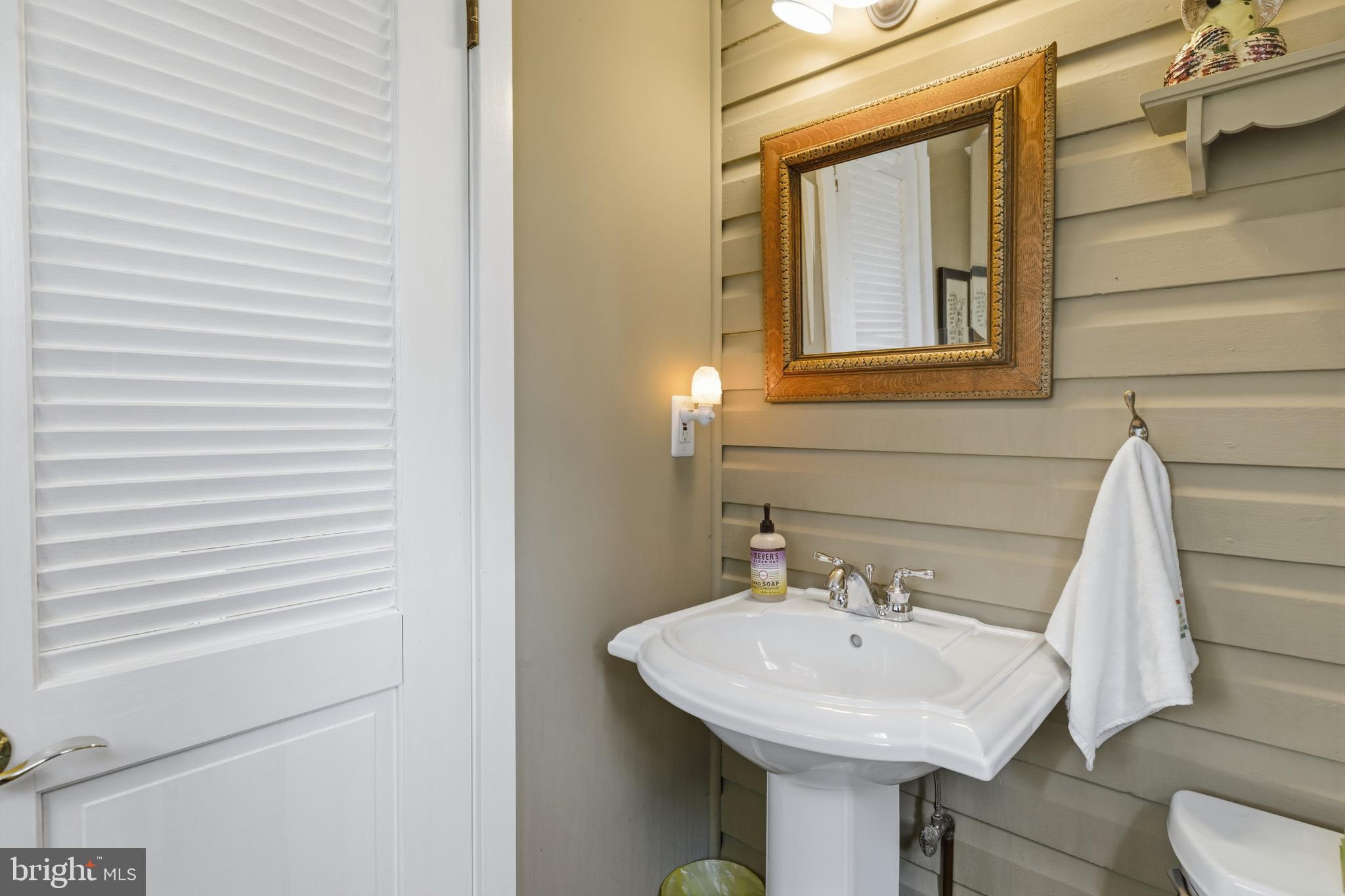 1268 Ashbourne Road Elkins Park, PA 19027 - Photo 16 of 46 a bathroom with a sink and a mirror