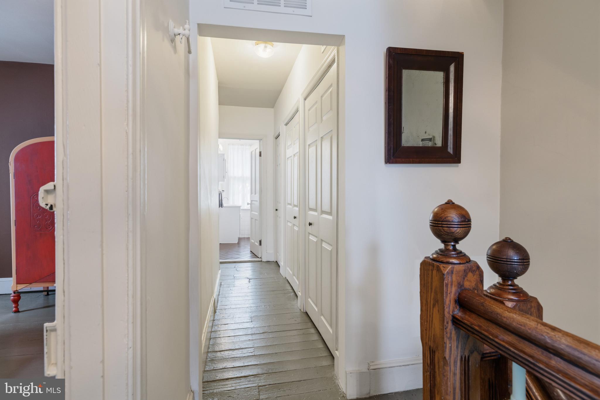 1268 Ashbourne Road Elkins Park, PA 19027 - Photo 18 of 46 a view of a hallway with wooden floor and staircase
