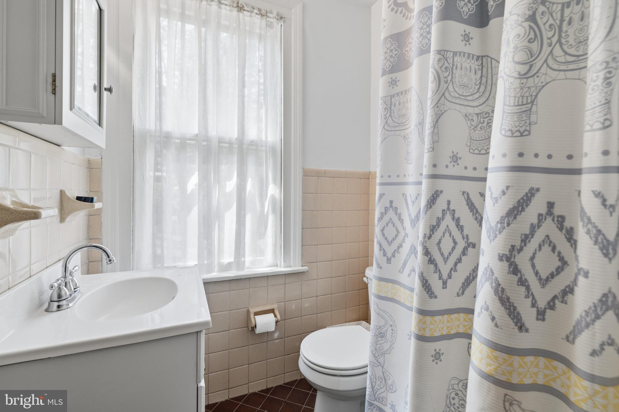 1268 Ashbourne Road Elkins Park, PA 19027 - Photo 20 of 46 a bathroom with a sink toilet and mirror