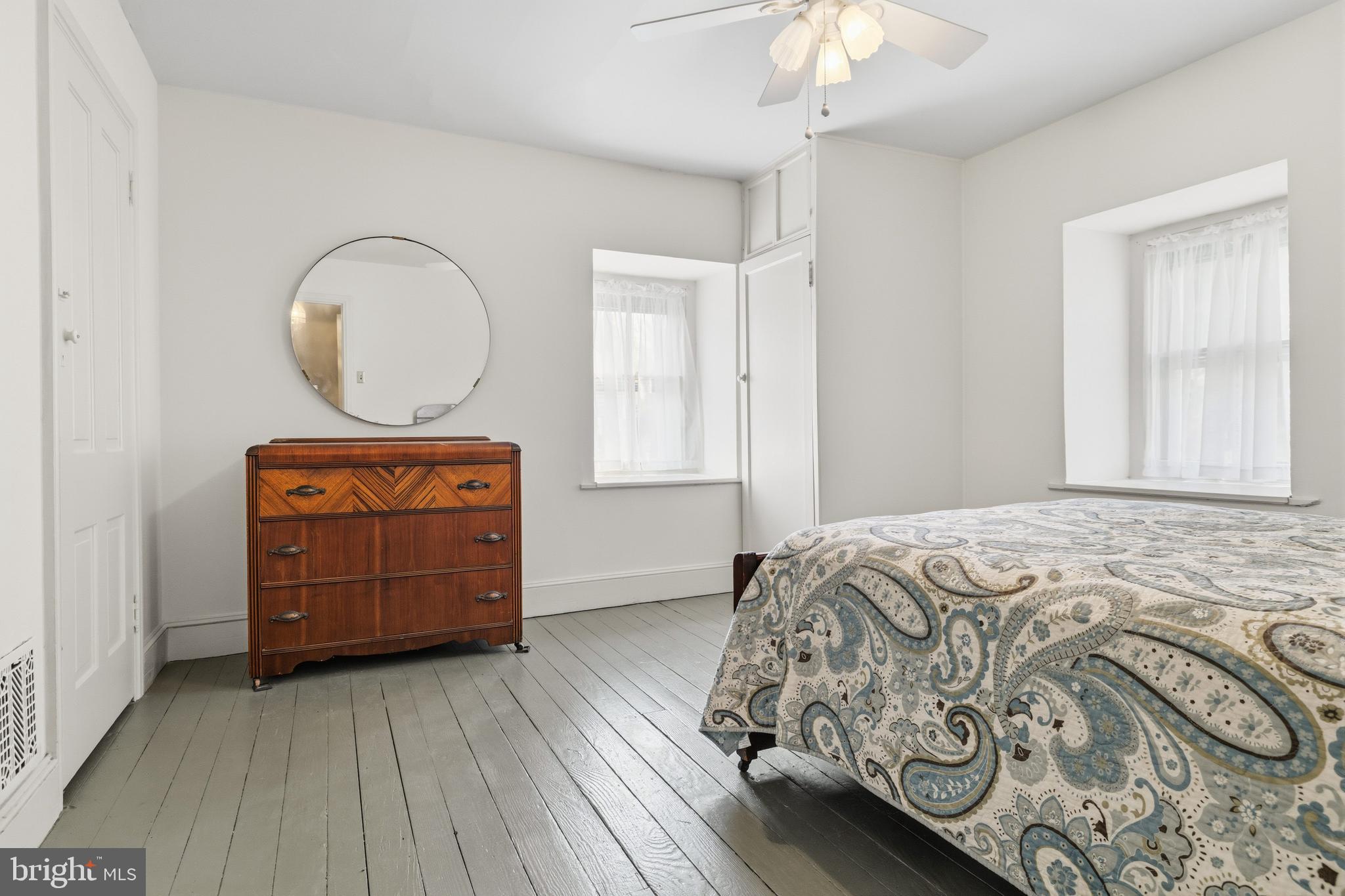 1268 Ashbourne Road Elkins Park, PA 19027 - Photo 29 of 46 a bedroom with a bed and a dresser