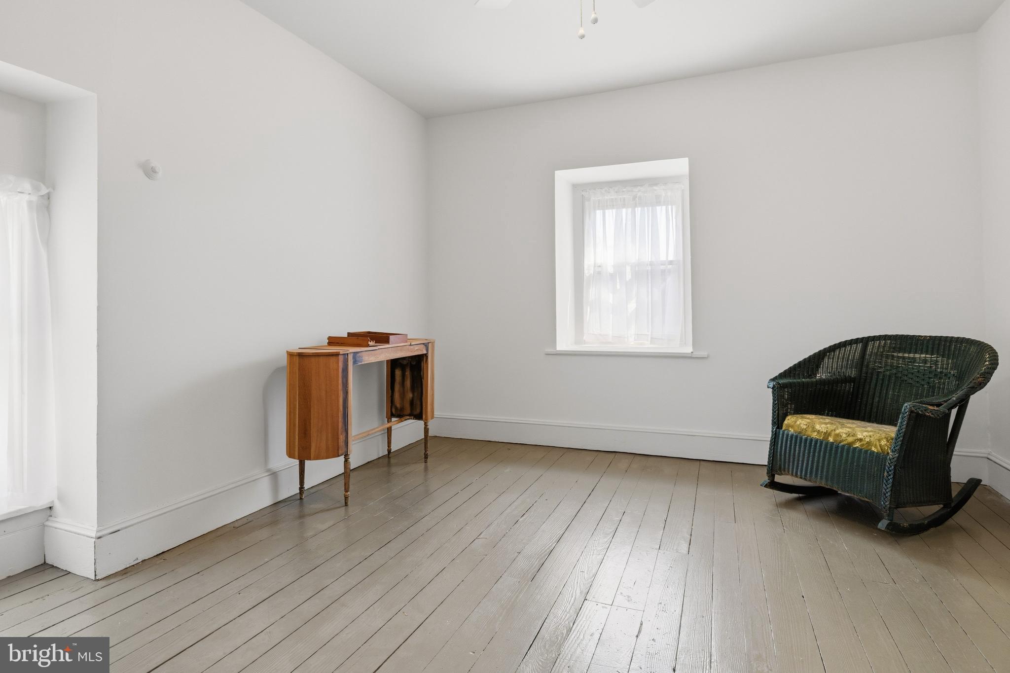 1268 Ashbourne Road Elkins Park, PA 19027 - Photo 30 of 46 a living room with a bed furniture and a window