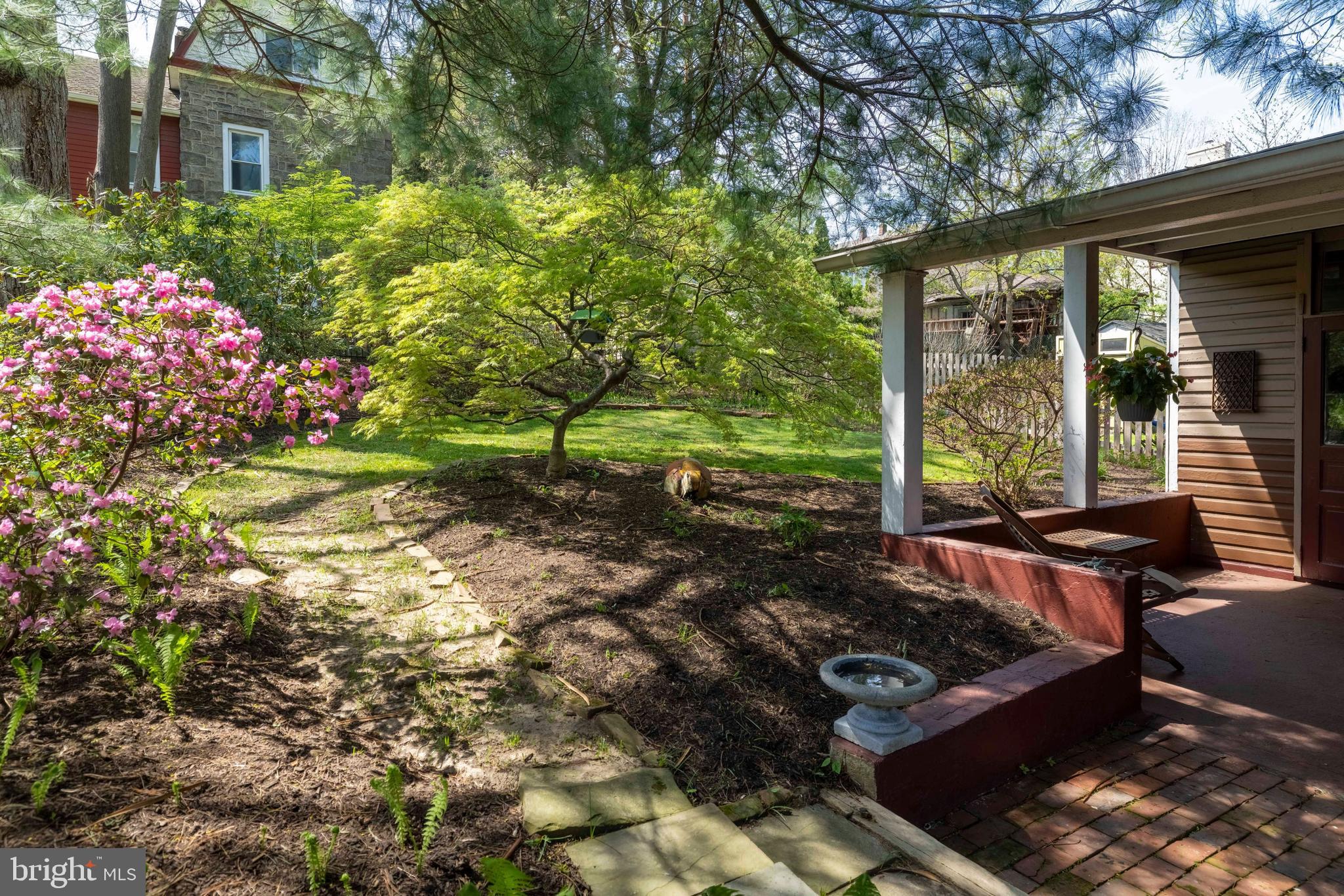 1268 Ashbourne Road Elkins Park, PA 19027 - Photo 35 of 46 a view of backyard with a garden and outdoor seating