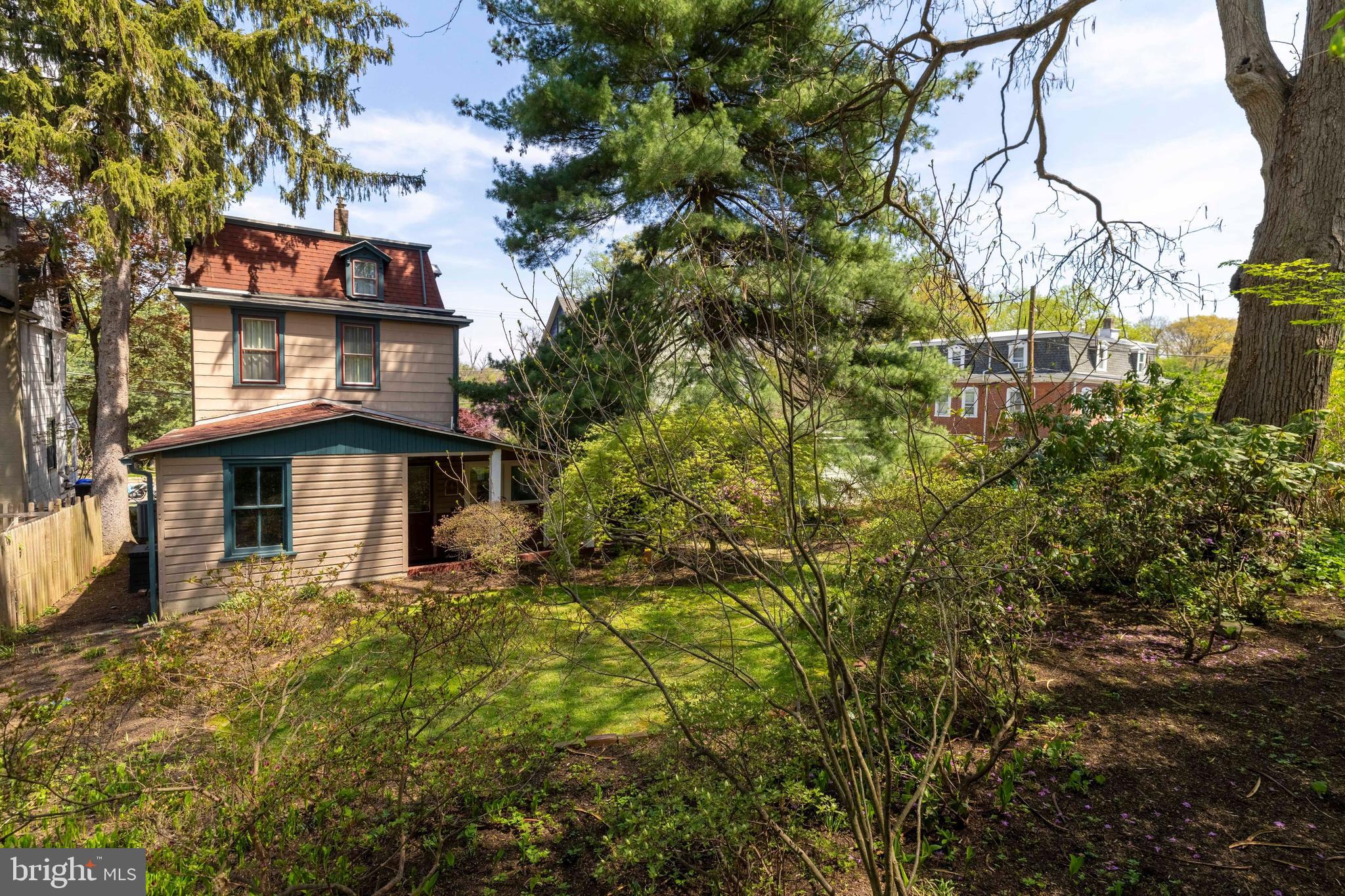 1268 Ashbourne Road Elkins Park, PA 19027 - Photo 38 of 46 a yellow building with trees in front of it