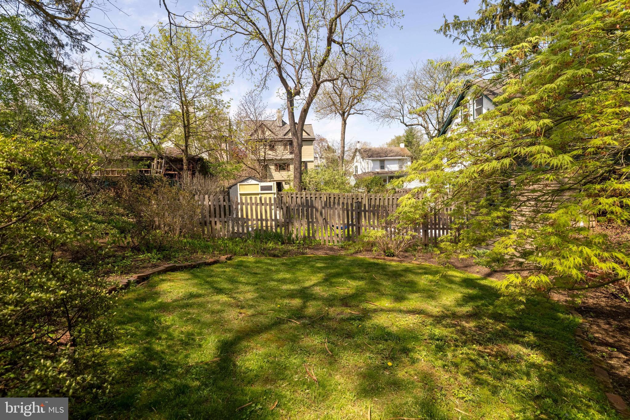 1268 Ashbourne Road Elkins Park, PA 19027 - Photo 40 of 46 a backyard of a building with large trees