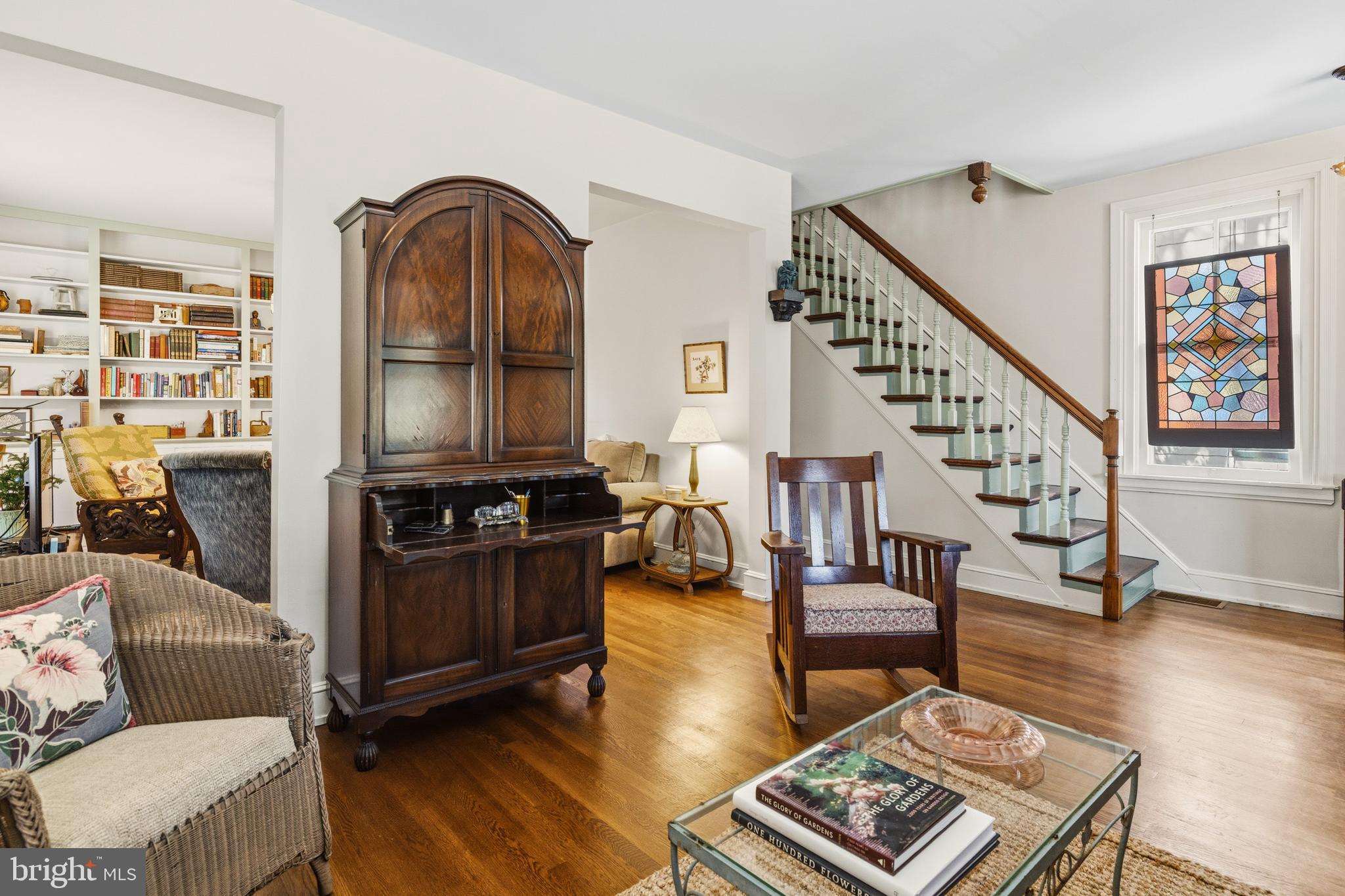 1268 Ashbourne Road Elkins Park, PA 19027 - Photo 7 of 46 a living room with fireplace furniture and a wooden floor