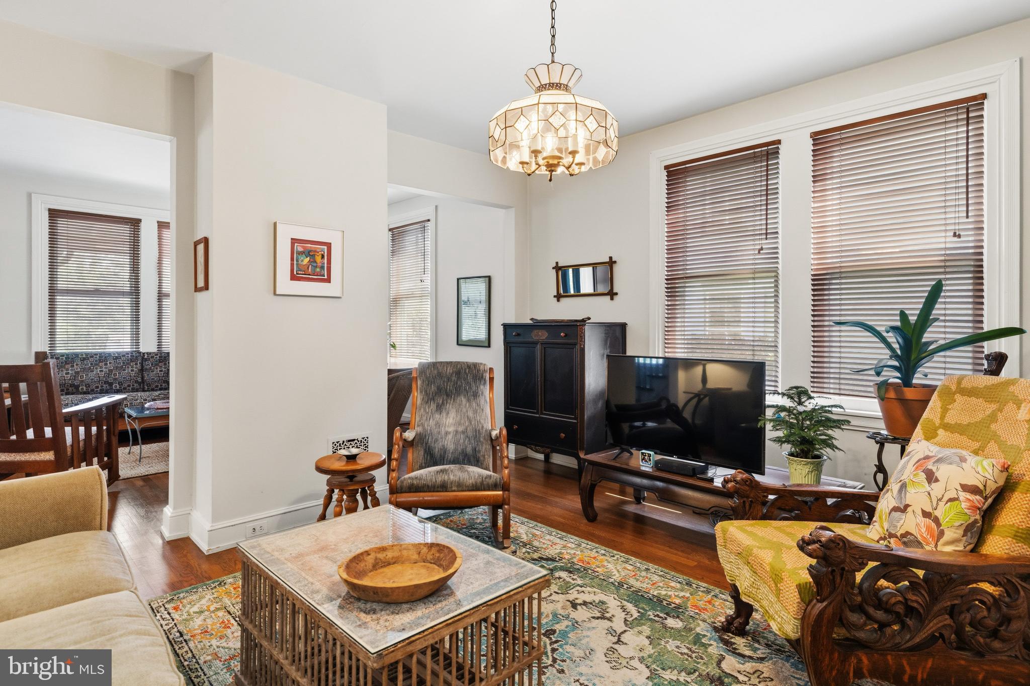 1268 Ashbourne Road Elkins Park, PA 19027 - Photo 8 of 46 a living room with furniture a flat screen tv and a table