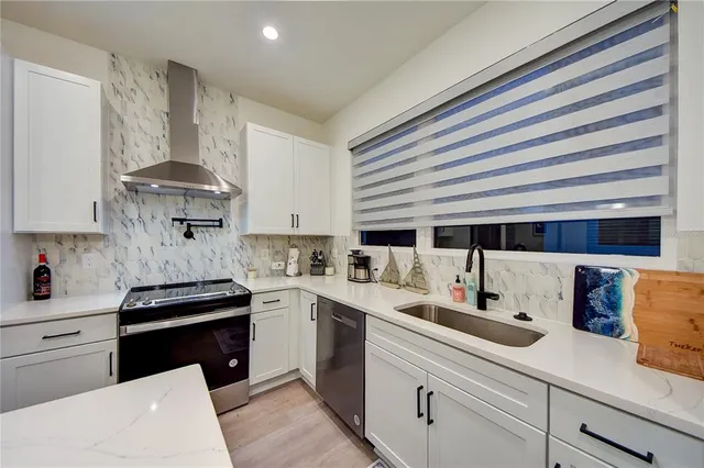 a kitchen with a stove and a refrigerator