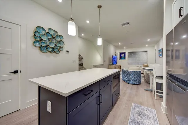 a view of staircase with white walls and railing