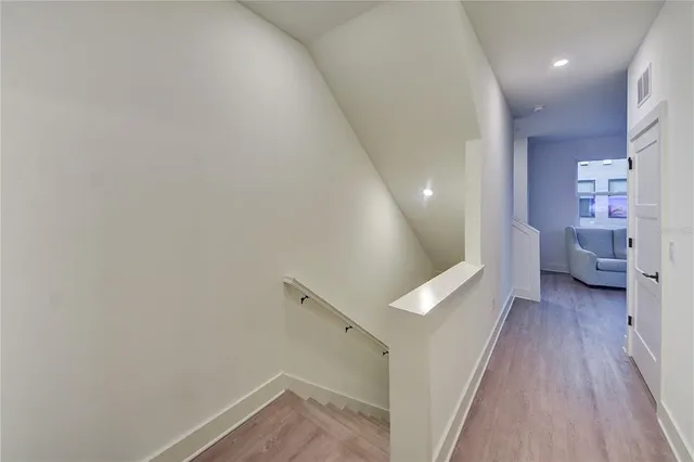 a bedroom with a bed a mirror and a table