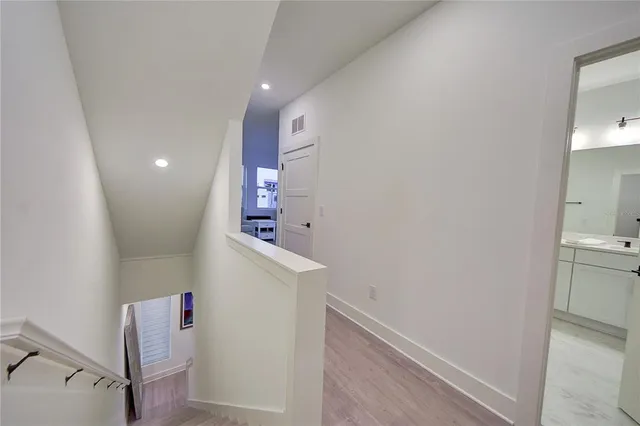 a bedroom with a bed and a table