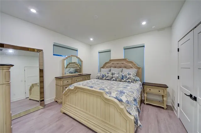 a bedroom with a bed and a closet