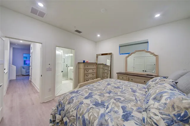 a bathroom with a double vanity sink mirror and shower