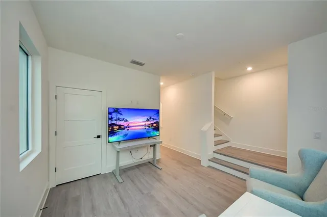 a view of a patio with table and chairs