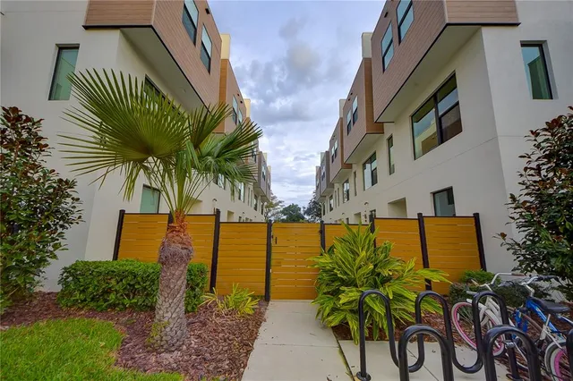 a view of a pathway besides a house