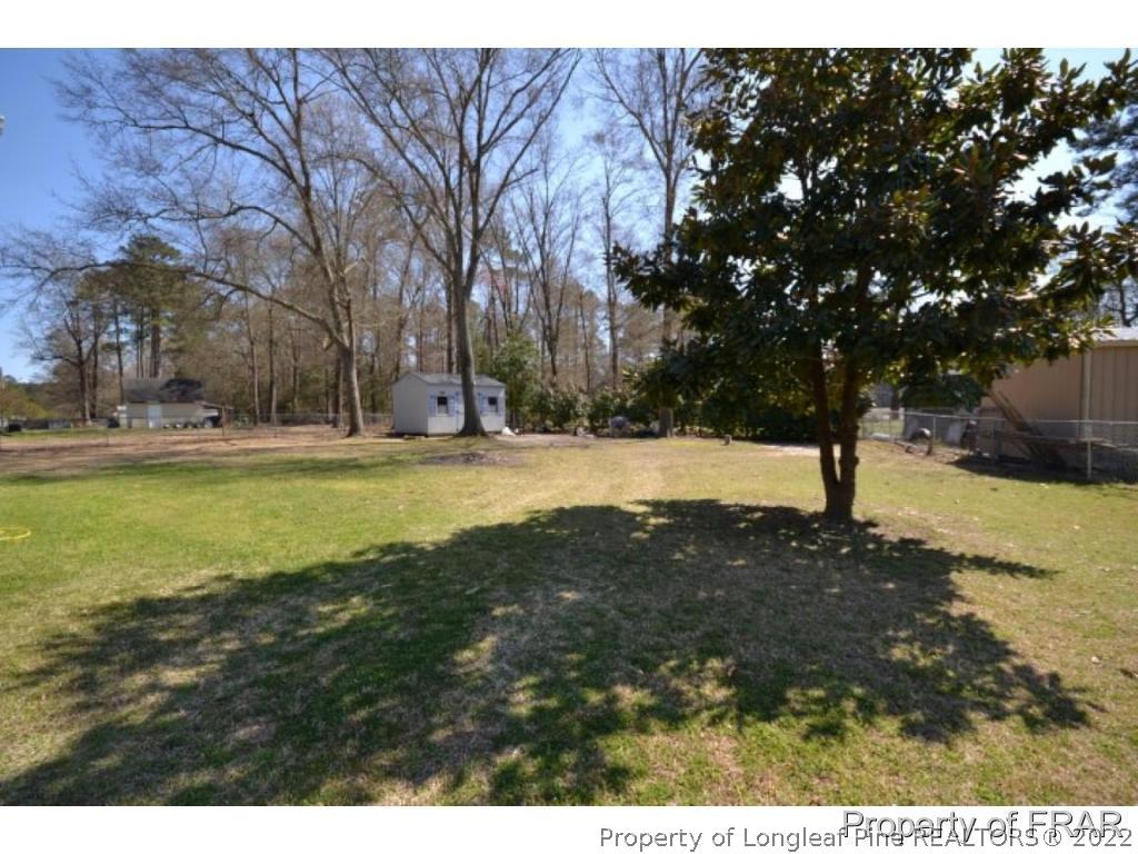 511 Berwick Drive Raeford, NC 28376 - Photo 19 of 26 a view of yard with tree
