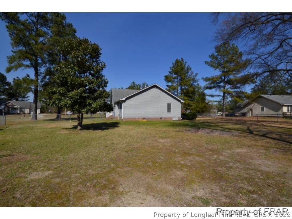 511 Berwick Drive Raeford, NC 28376 - Photo 20 of 26 a house view with a garden space