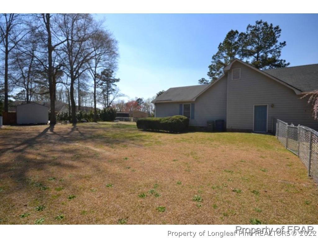 511 Berwick Drive Raeford, NC 28376 - Photo 21 of 26 a view of backyard of house