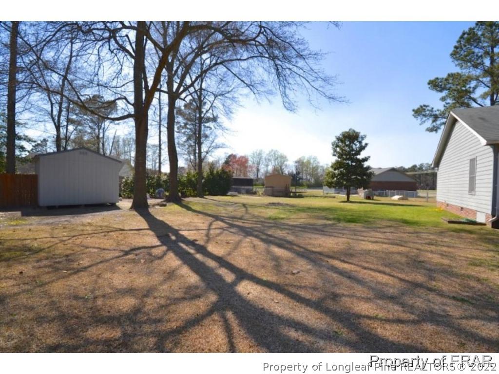 511 Berwick Drive Raeford, NC 28376 - Photo 22 of 26 a view of a backyard