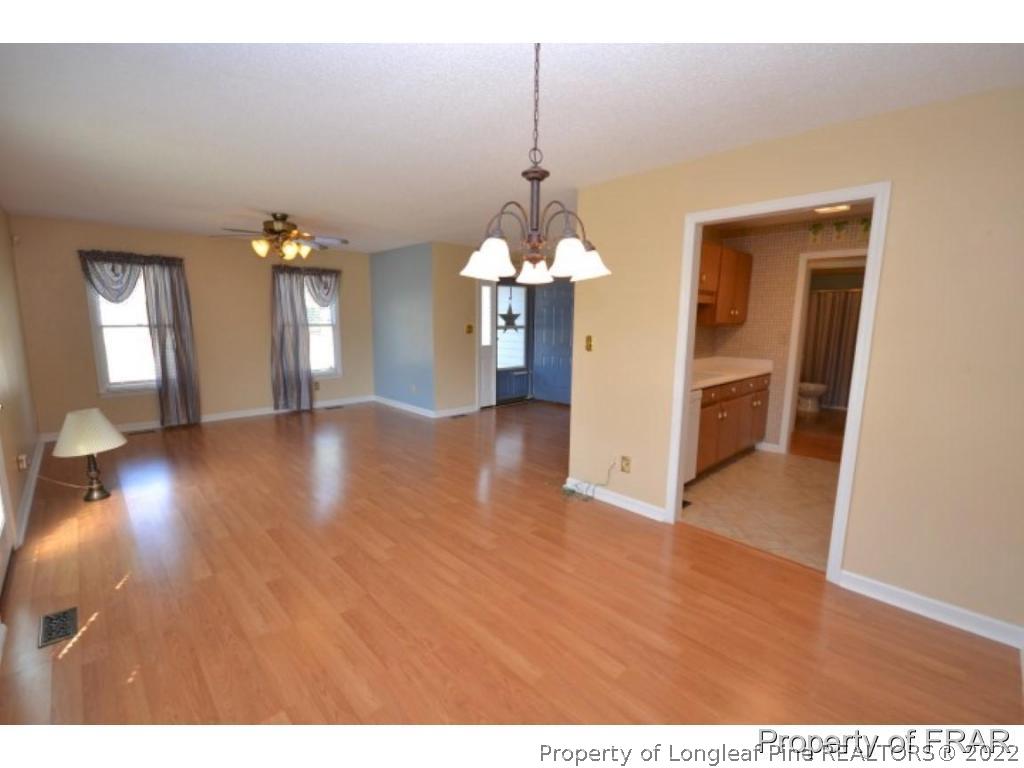 511 Berwick Drive Raeford, NC 28376 - Photo 9 of 26 a view interior of a house livingroom and chandelier