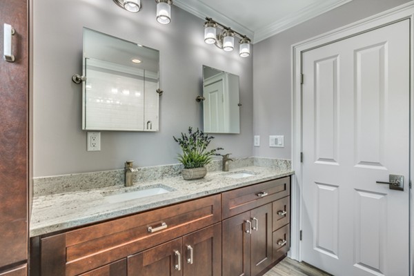 234 Ridge Street Winchester, MA 01890 - Photo 11 of 26 a bathroom with a granite countertop sink and a mirror