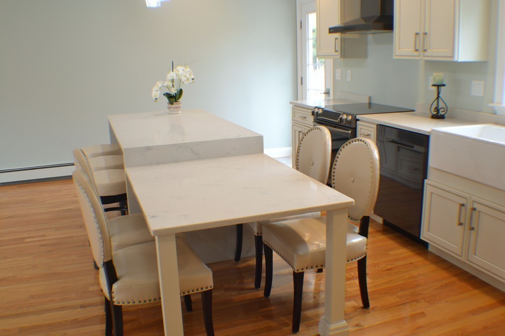 234 Ridge Street Winchester, MA 01890 - Photo 9 of 26 a view of a dining room with furniture and wooden floor