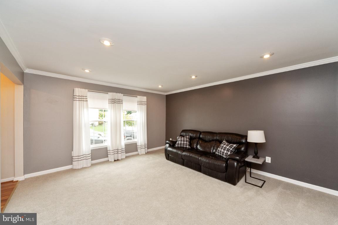 8117 Timberbrooke Road Baltimore, MD 21237 - Photo 13 of 35 Living room with double windows for good lighting