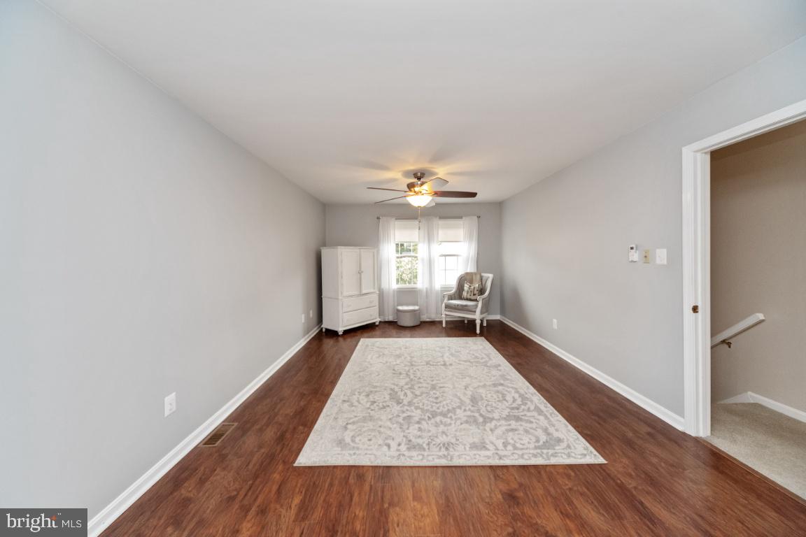 8117 Timberbrooke Road Baltimore, MD 21237 - Photo 17 of 35 Updated flooring enhances primary bedroom suite