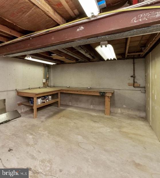 8117 Timberbrooke Road Baltimore, MD 21237 - Photo 32 of 35 Workroom with workbenches and storage!