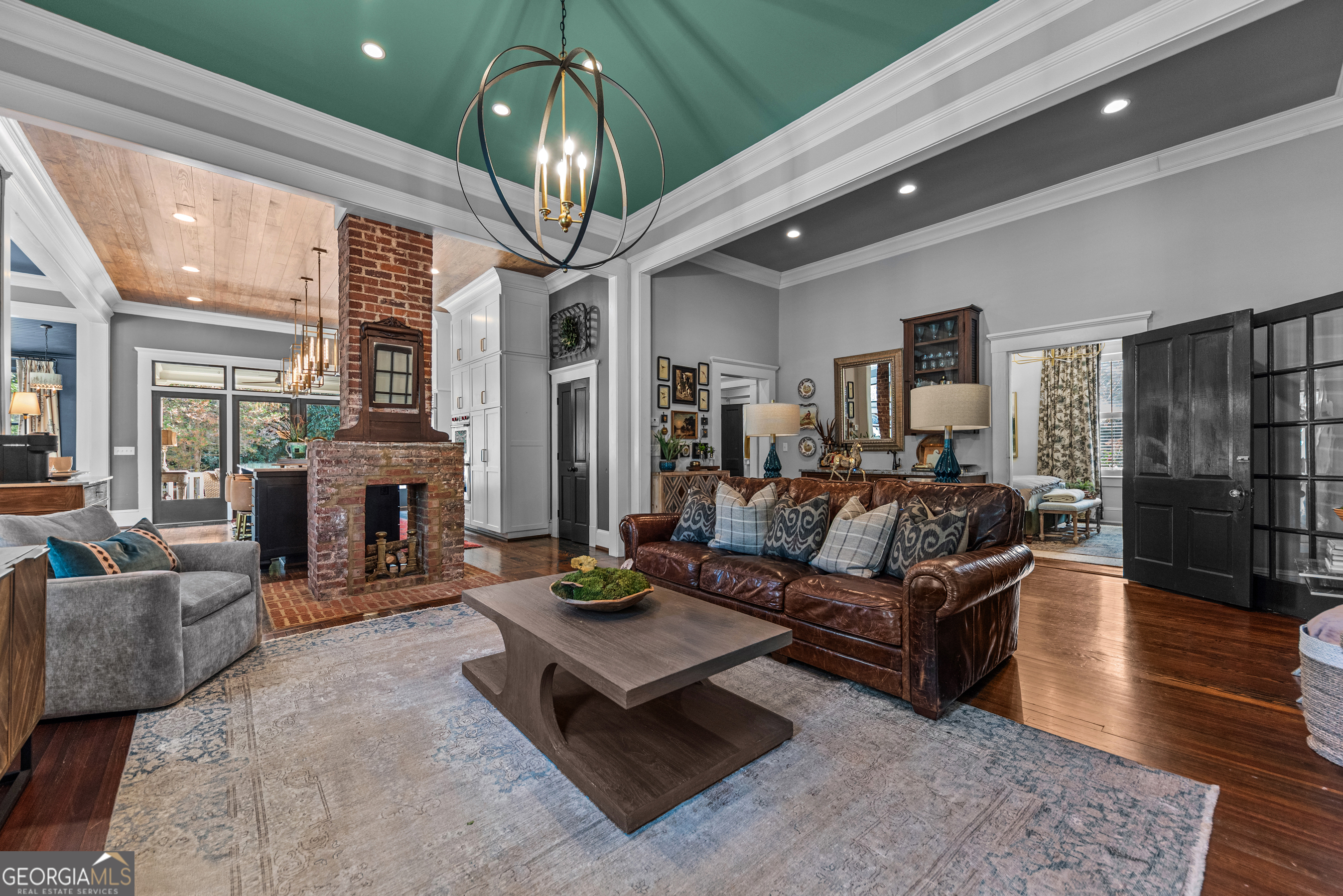 668 North Main Street Madison, GA 30650 - Photo 13 of 88 a living room with fireplace furniture and a chandelier