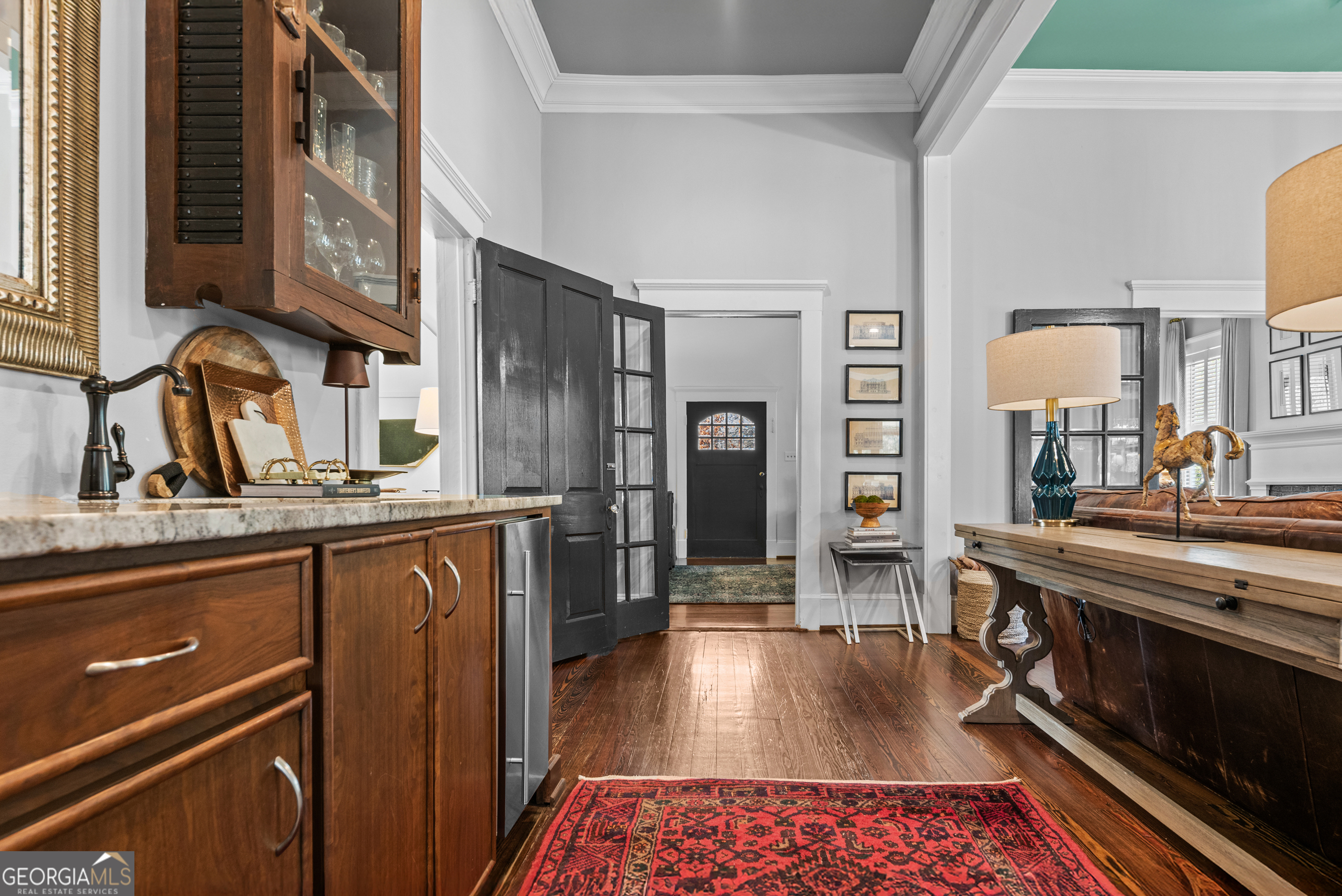 668 North Main Street Madison, GA 30650 - Photo 15 of 88 a kitchen with stainless steel appliances granite countertop a sink stove and refrigerator