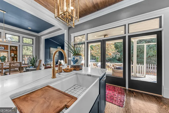 a bed room with a bed and a chandelier